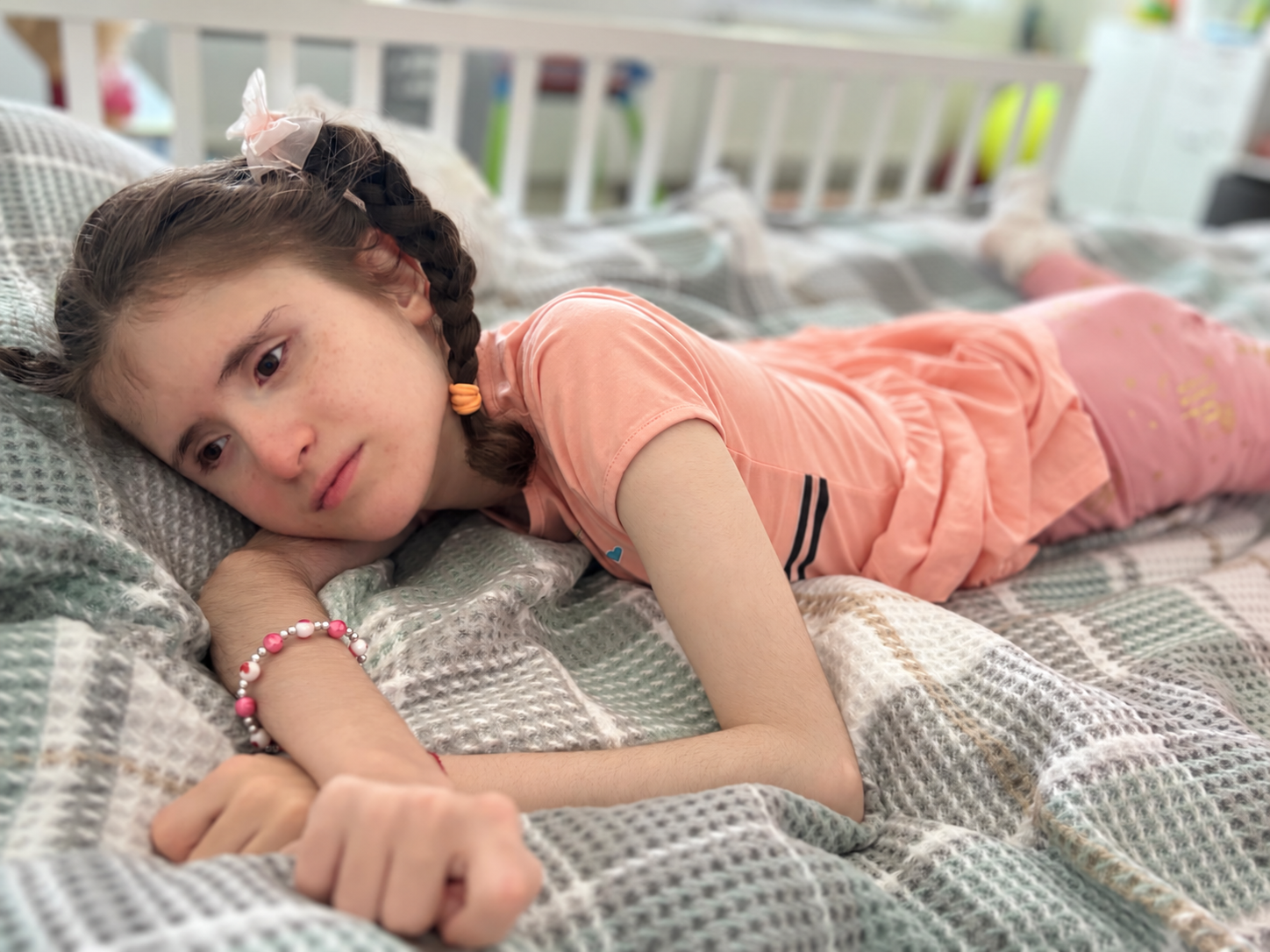 Samira resting on a soft blanket